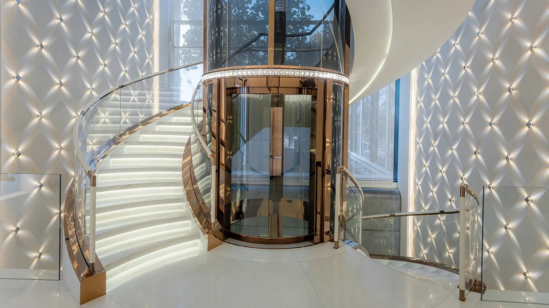 Interior lift circled by spiral staircase in ultra luxury villa fit out by havelock one on palm jumeirah